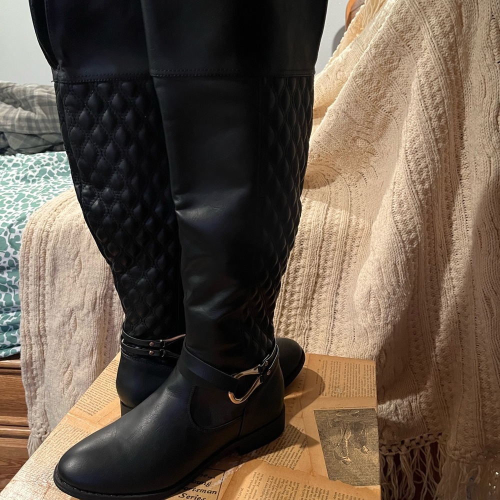 Never worn women’s black calf-length boots